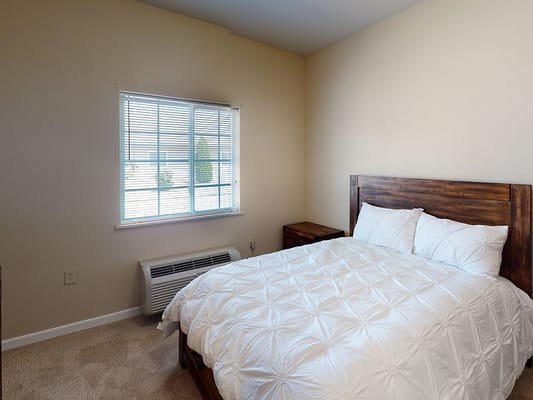 A well-furnished private resident room with natural light