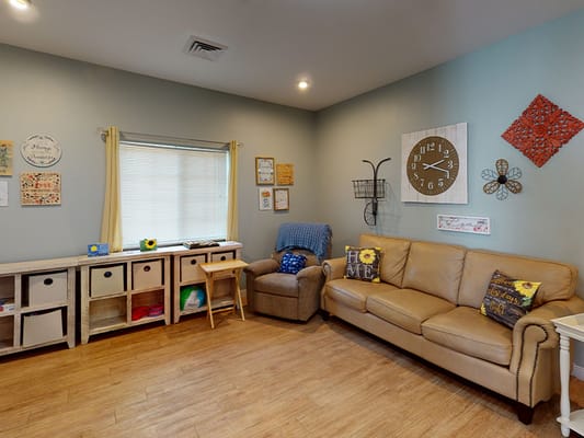 Common area with seating and decorative wall art