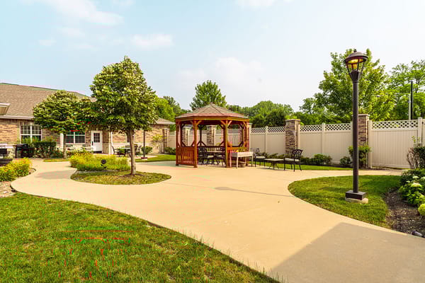 Outdoor gazebo and pathway in a landscaped area