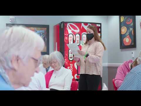 A staff member leading an activity with residents