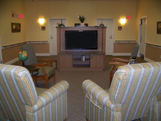 Interior common area with seating and television