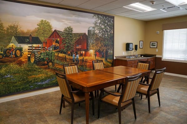 Dining area with a mural of a barn and tractors
