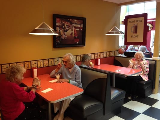 Residents enjoying ice cream in a dining area
