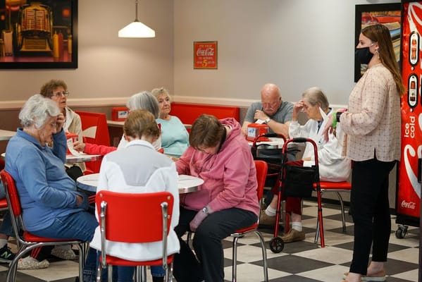 Residents participating in an activity in the dining room
