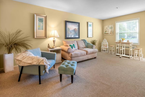 Cozy lounge area with comfortable seating and natural light