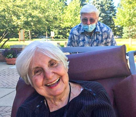 Residents enjoying time outdoors in a garden area