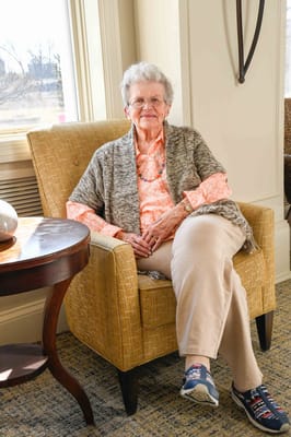 Senior resident in a cozy lounge chair