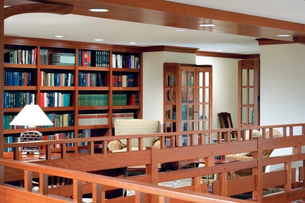Cozy library area with bookshelves and seating