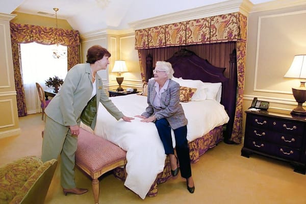Two residents interacting in a well-furnished room