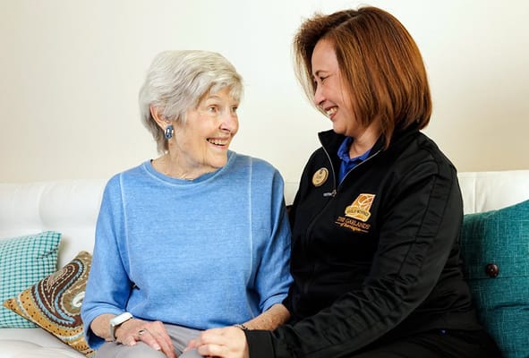 Resident and staff member sharing a joyful moment
