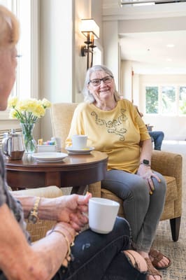 Residents enjoying coffee in a common area