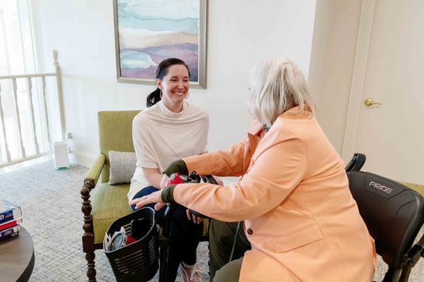 Residents enjoying conversation in a cozy communal area