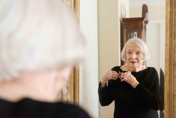 Resident admiring herself in a mirror