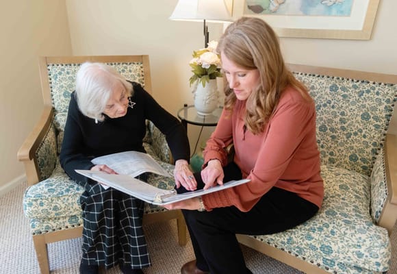 Staff member assisting a resident with paperwork