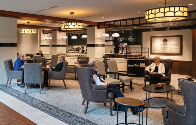 Residents socializing in the dining area