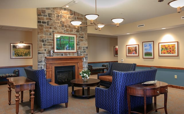 Cozy common area with comfortable seating and artwork