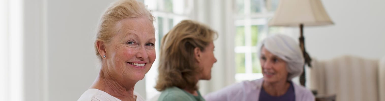 Residents chatting in a bright common area