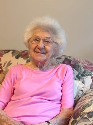 Smiling elderly woman in a cozy living room