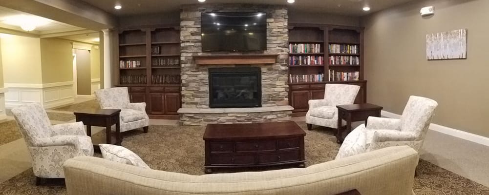 Cozy common area with seating and a fireplace