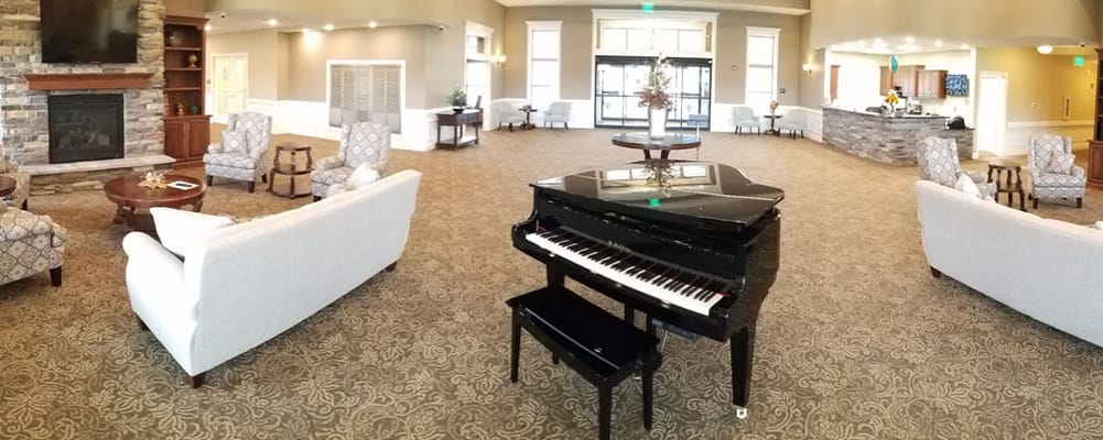 Interior common area with seating and a piano