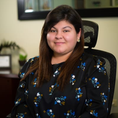 Staff member smiling in an office setting