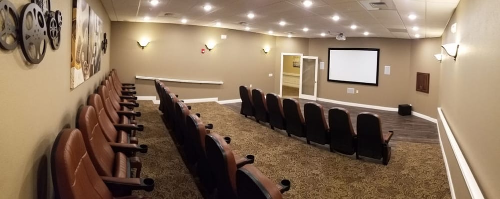 Interior view of a cozy theater room with seating