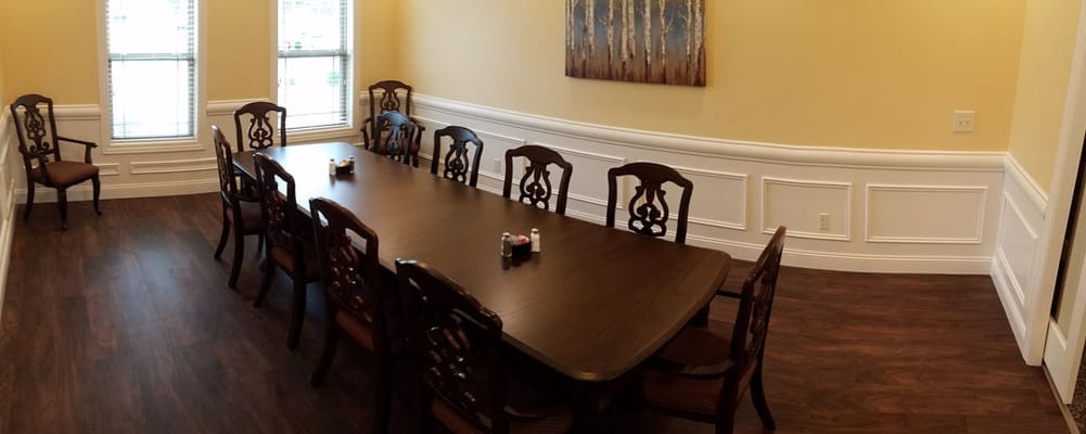 Dining room with a long table and chairs