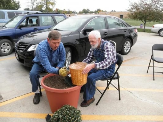 Residents gardening together during an outdoor activity