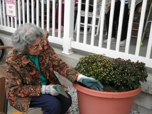 Senior resident gardening outdoors