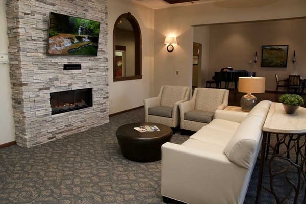 Cozy common area featuring seating and a television