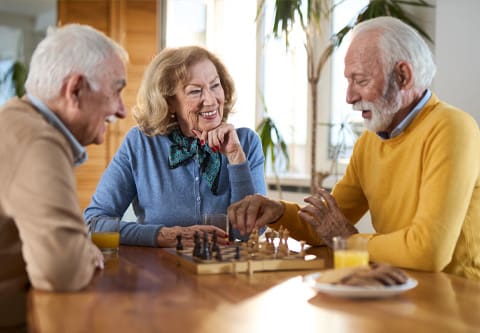 Seniors enjoying a chess game together