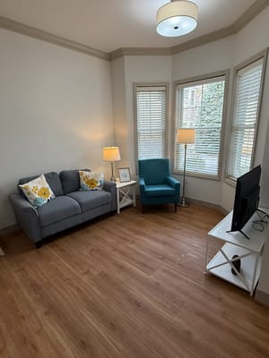 Cozy interior seating area with a sofa and chairs