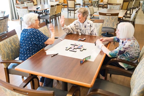 Residents playing a game in a common area