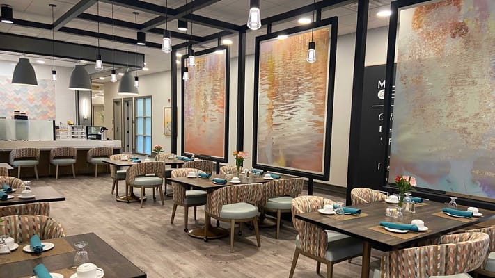 Modern dining room with elegant decor and tables set