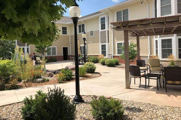 Outdoor courtyard with seating and residents