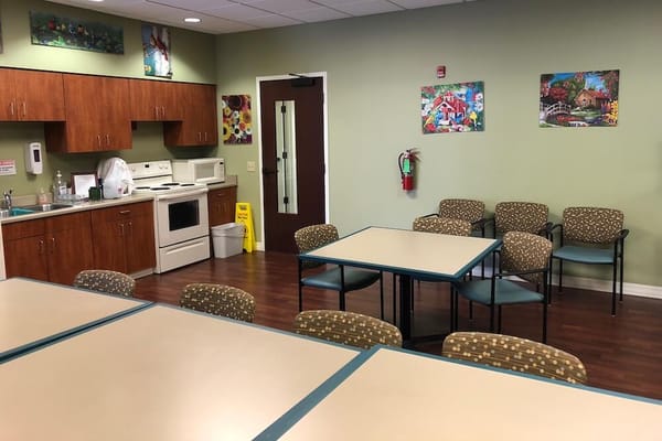 Common area with tables and seating in a dining facility