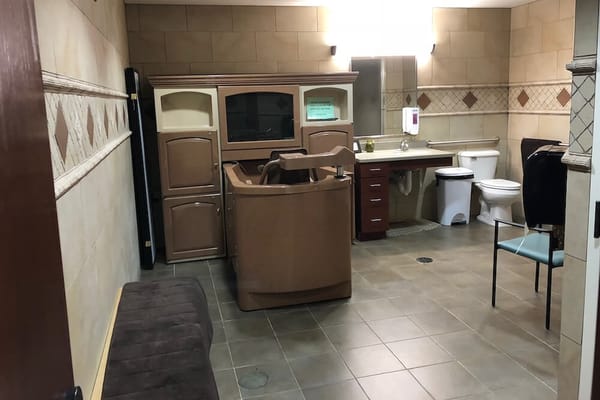 Interior bathroom with a unique bathtub and vanity.