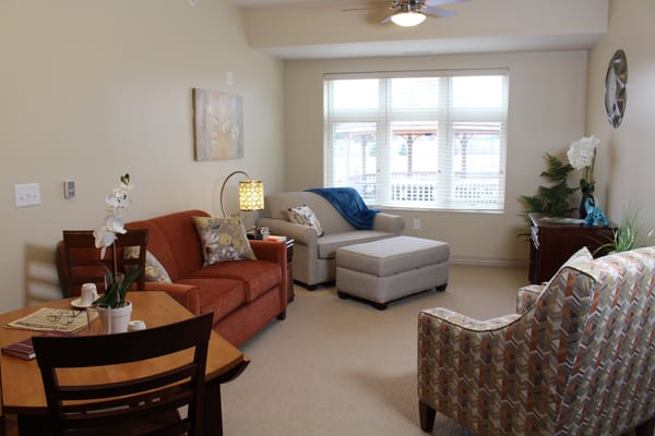 Well-furnished common area with natural light