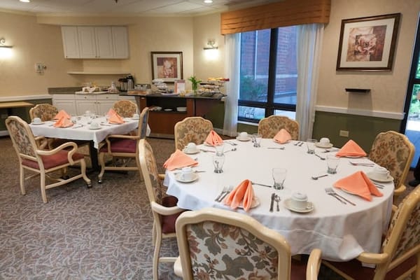 Dining area set up for a meal with elegant decor