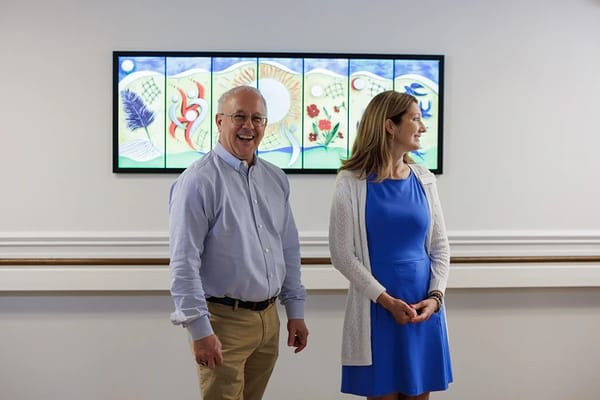 Staff and residents interacting in a common area