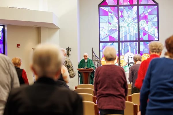 Residents participating in a worship service in the chapel.