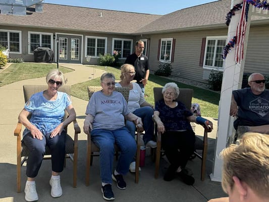 Residents enjoying an outdoor gathering at the facility