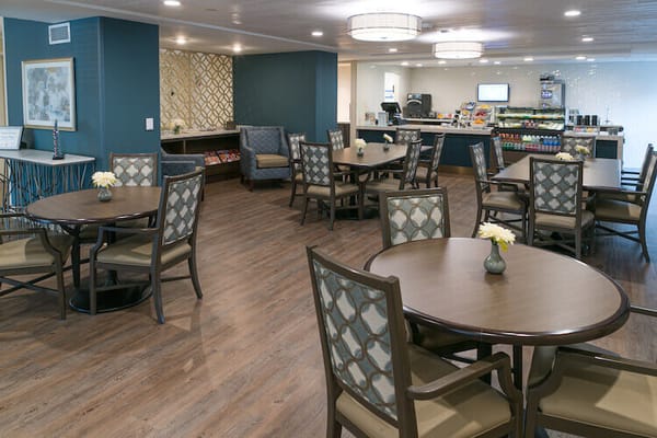 Bright dining area with tables and chairs
