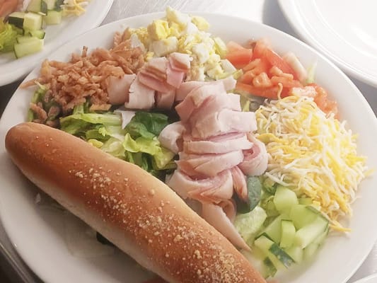 A colorful salad meal served in a dining area