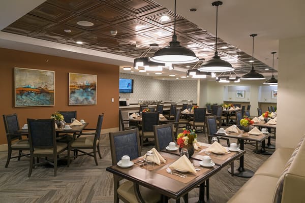 Dining room setup with tables and decorations