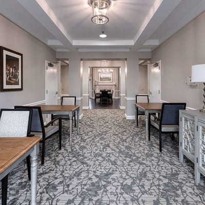 Bright interior corridor with tables and seating