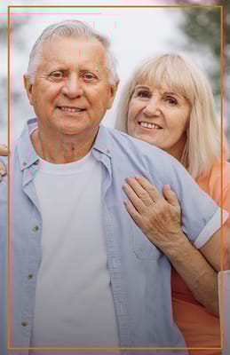 Happy senior couple outdoors in a casual setting