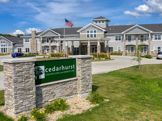 Exterior view of Cedarhurst of Yorkville with flag and sign
