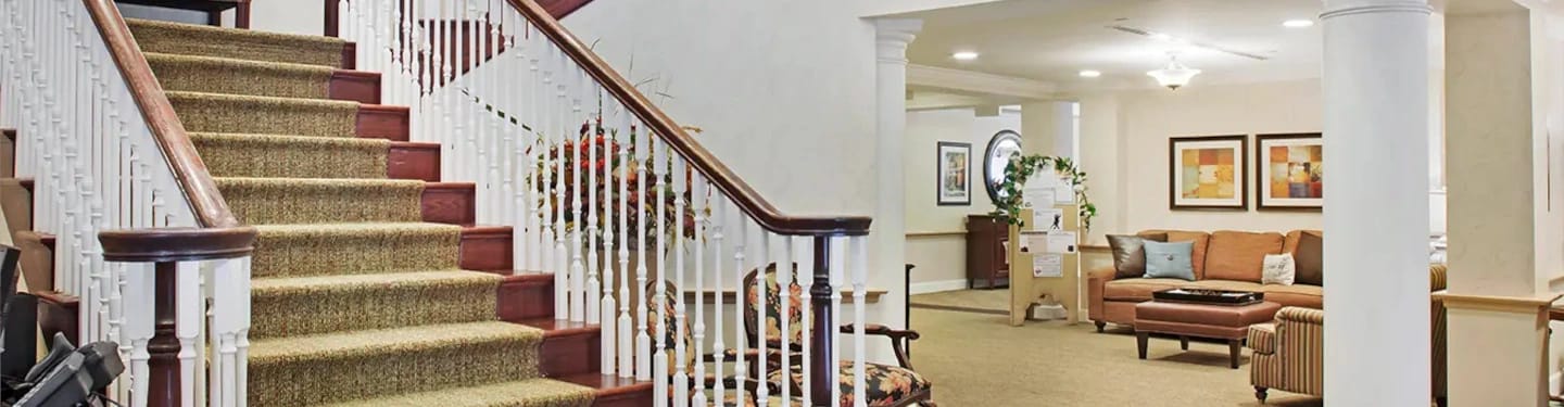 Interior view of a community living area with stairs