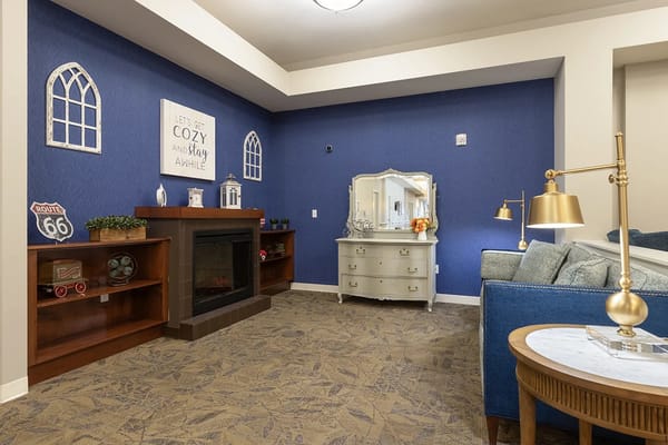 Interior view of a cozy common area with blue accents